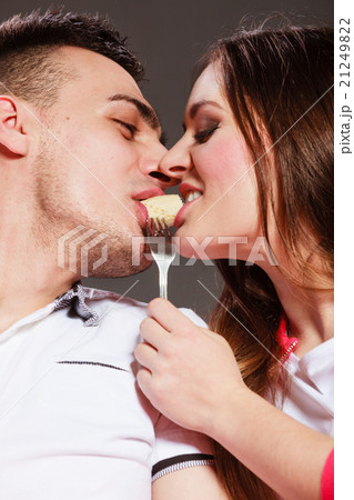young couple eating banana fruit together young couple eating banana fruit together 21249822