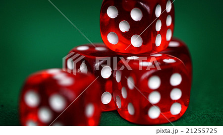 Red dice on a green felt Red dice on a green felt 21255725