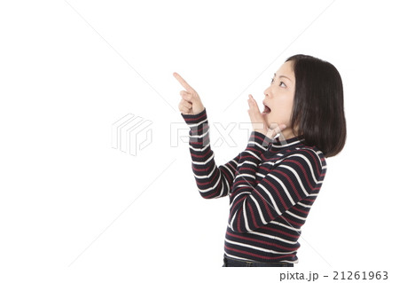 指差しポーズの若い女性の写真素材
