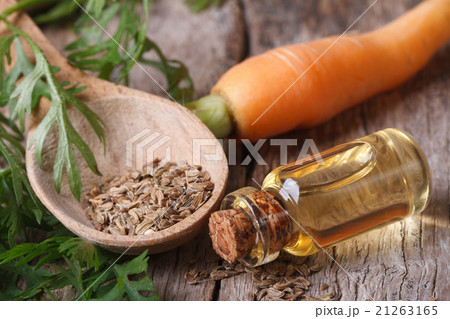 oil of carrot seeds in a glass bottle oil of carrot seeds in a glass bottle 21263165