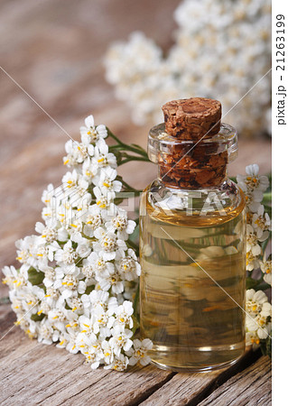 Tincture of yarrow on a background of flowers 21263199