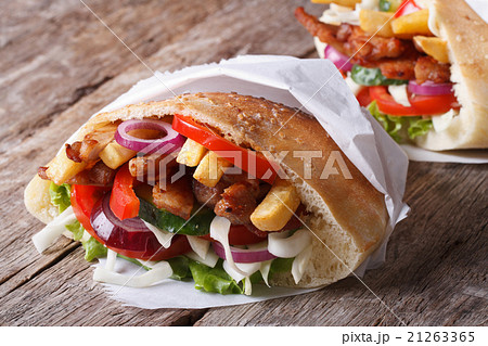 Shawarma in pita bread close-up on the table Shawarma in pita bread close-up on the table 21263365