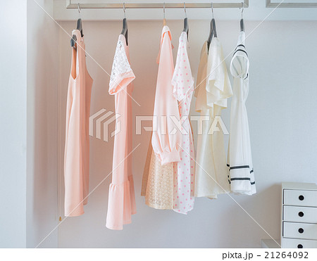 white closet with dress hanging white closet with dress hanging 21264092