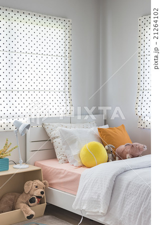 kid's bedroom with colorful pillows and dolls 21264102