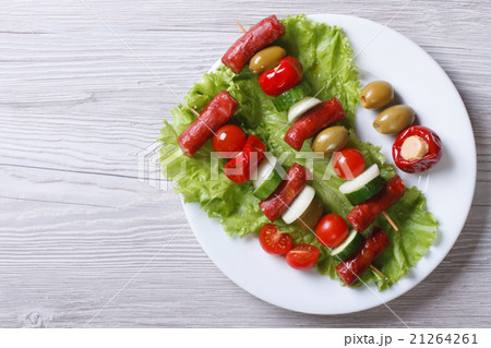 grilled sausages with vegetables top view 21264261