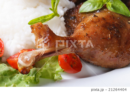roasted duck leg with rice and basil on lettuce roasted duck leg with rice and basil on lettuce 21264404