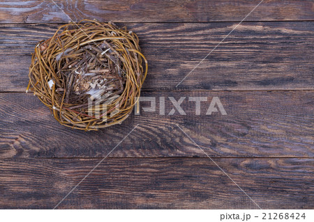 Empty birds nest on wooden background 21268424