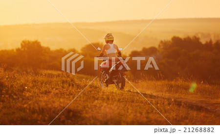 Woman biker in sunset, female motorcycle. Woman biker in sunset, female motorcycle. 21268882
