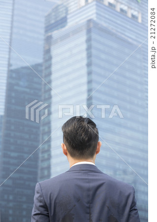 Behind view of an Asian businessman looking away. 21272084