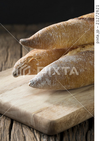 Bread loaves on an old rustic wooden table. 21272621