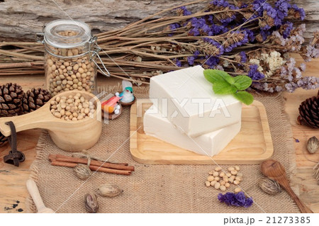 Tofu and soybeans on wood background. 21273385