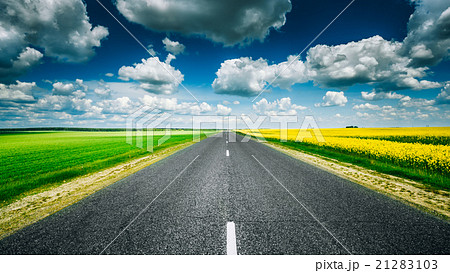 Empty Asphalt Countryside Road Through Fields With 21283103