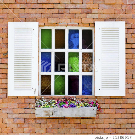 Brick Wall with colorful glasses in White Window Brick Wall with colorful glasses in White Window 21286917