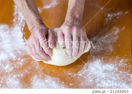 Hands of a male baker making bread 21288003