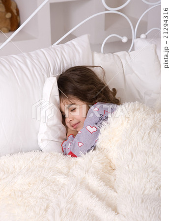 Tired little girl sleeps Tired little girl sleeps 21294316