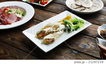 Crepes rolls filled with salted salmon. 21297239