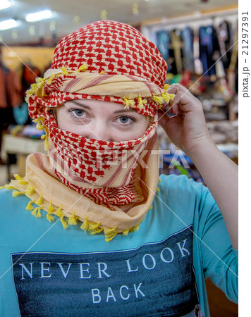 girl of Slavic appearance wearing a headscarf Arab girl of Slavic appearance wearing a headscarf Arab 21297391