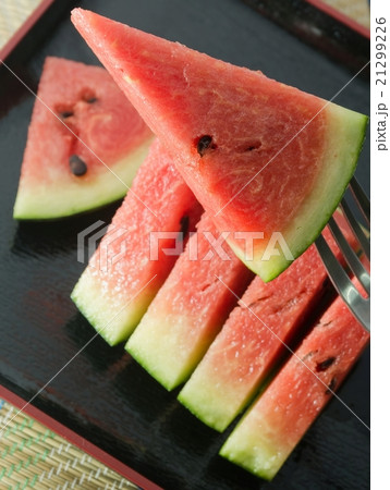 Sliced of Red Watermelon on A Black Tray 21299226