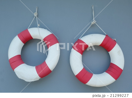 Two Life Buoy Hanging on A Wall 21299227