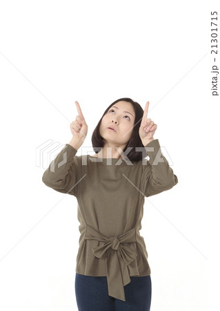 指差しポーズの若い女性の写真素材