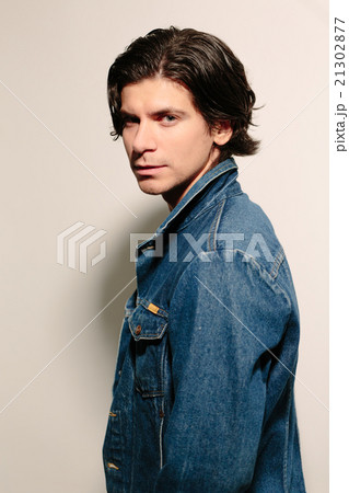 Attractive young man in a jeans jacket. 21302877