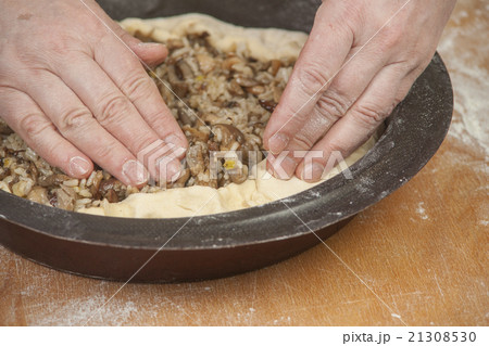 Putting filling on raw dough Putting filling on raw dough 21308530