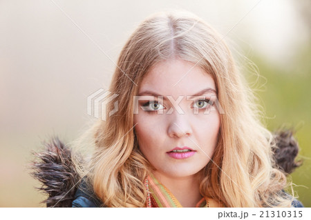 Portrait sad attractive woman outdoor 21310315