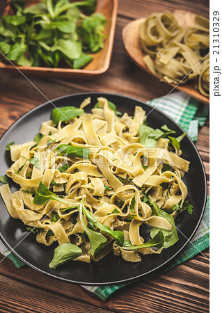 Cooked tagliatelle on a plate Cooked tagliatelle on a plate 21310329