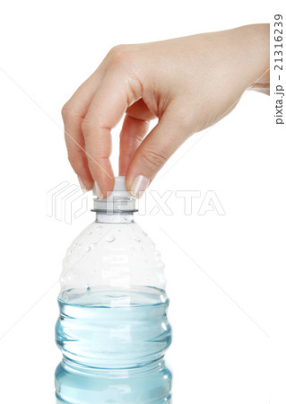 Woman opens a water bottle Woman opens a water bottle 21316239