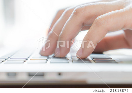 Closeup of business woman hand typing on laptop keyboard 21318875