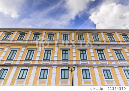 Yellow apartment with green wooden with clear sky 21324359