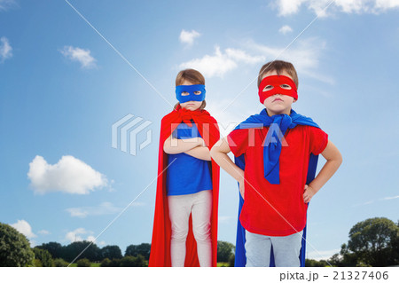 Composite image of masked kids pretending to be superheroes 21327406