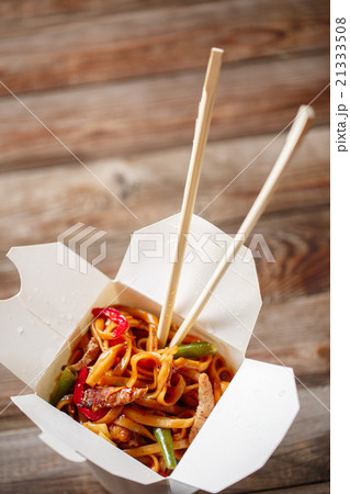 Noodles with pork and vegetables in take-out box Noodles with pork and vegetables in take-out box 21333508