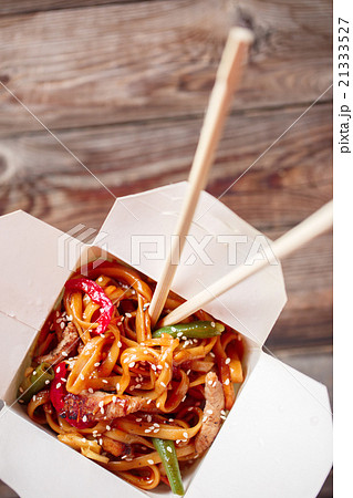 Noodles with pork and vegetables in take-out box Noodles with pork and vegetables in take-out box 21333527