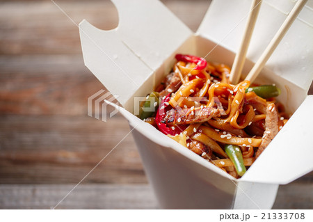 Noodles with pork and vegetables in take-out box Noodles with pork and vegetables in take-out box 21333708