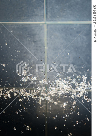 Drops of water levitate in bathroom 21338430