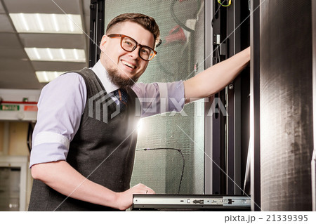 Young engineer in a datacenter 21339395