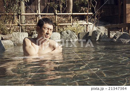 温泉に浸かる男性の写真素材