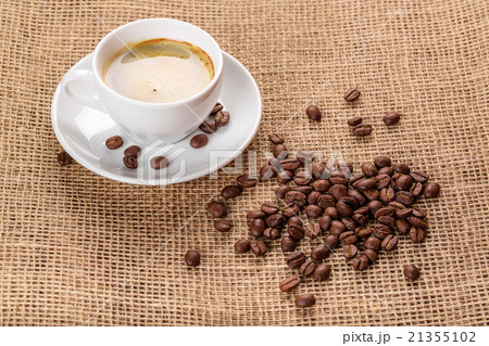 coffee cup and saucer and coffee beans coffee cup and saucer and coffee beans 21355102
