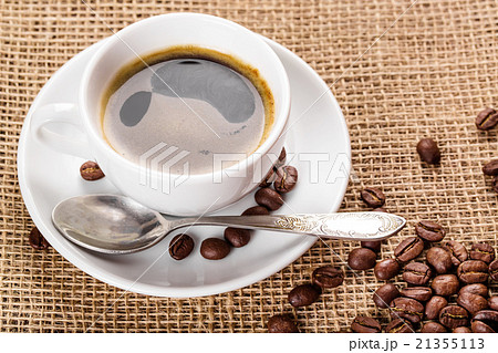 white coffee cup and saucer and coffee beans white coffee cup and saucer and coffee beans 21355113