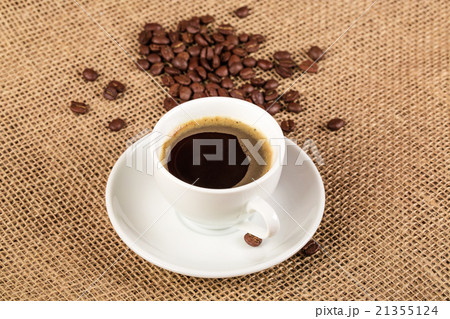 white coffee cup and saucer and coffee beans white coffee cup and saucer and coffee beans 21355124