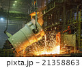 steel worker takes a sample of hot metal 21358863