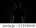 Determined  man walking in the snow at night 21359048