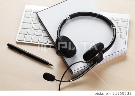 Office desk with headset. Call center support Office desk with headset. Call center support 21359532