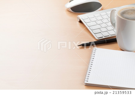 Office desk table with supplies and coffee cup Office desk table with supplies and coffee cup 21359533