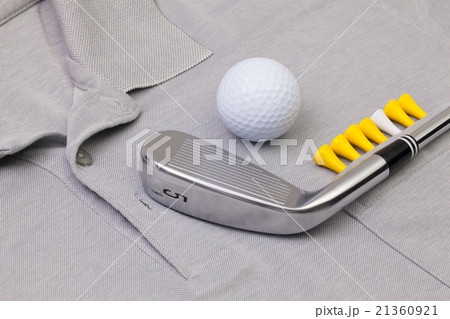 Grey polo shirt and golf equipments Grey polo shirt and golf equipments 21360921