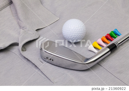 Grey polo shirt and golf equipments 21360922