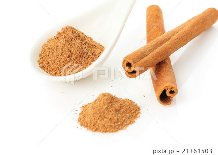 Cinnamon sticks and powder on white background Cinnamon sticks and powder on white background 21361603