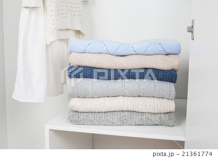 Stack of knitted warm woolen clothes Stack of knitted warm woolen clothes 21361774