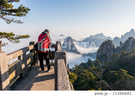 Monkey watch sea cloud ,Mt. Huangshan in China Monkey watch sea cloud ,Mt. Huangshan in China 21366681